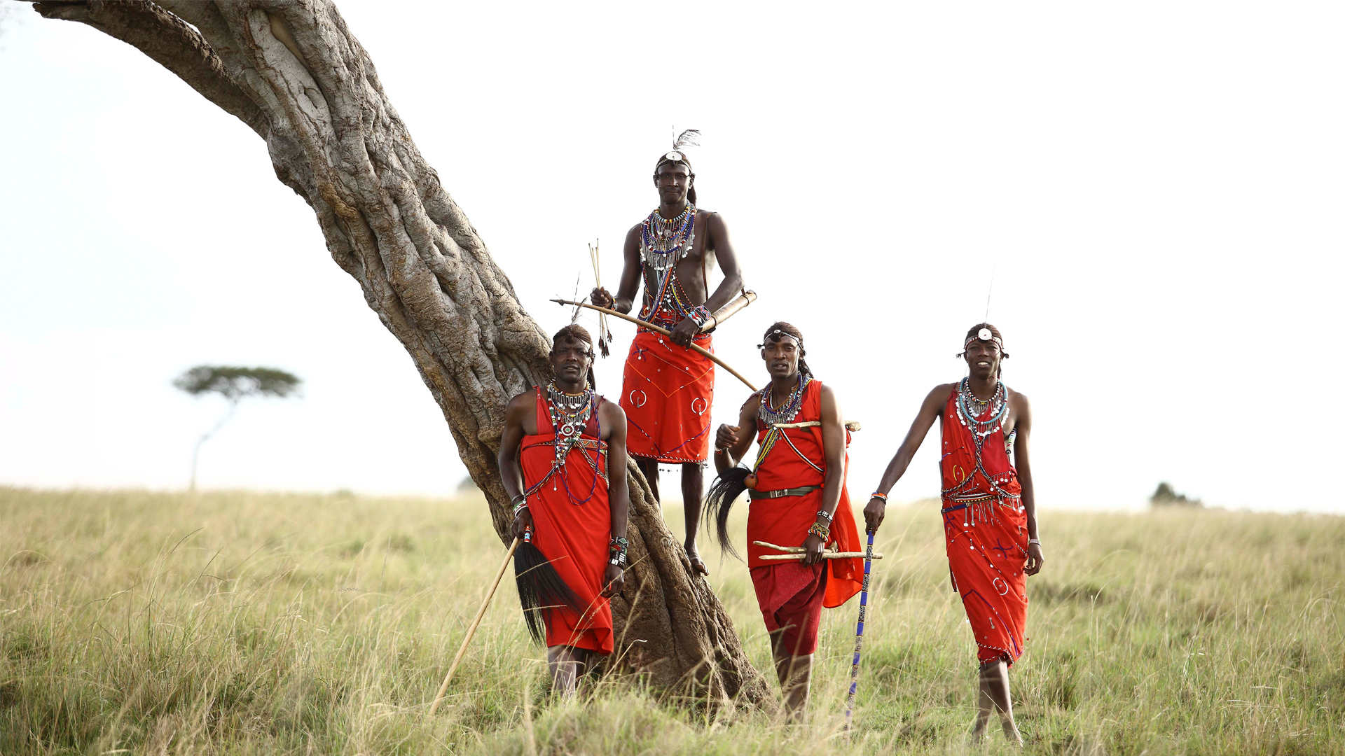 maasai-men-standing-by-a-tree-in-the-masai-mara